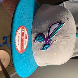 Charlotte Hornets New Era Snap Back. Pre Owned in great condition